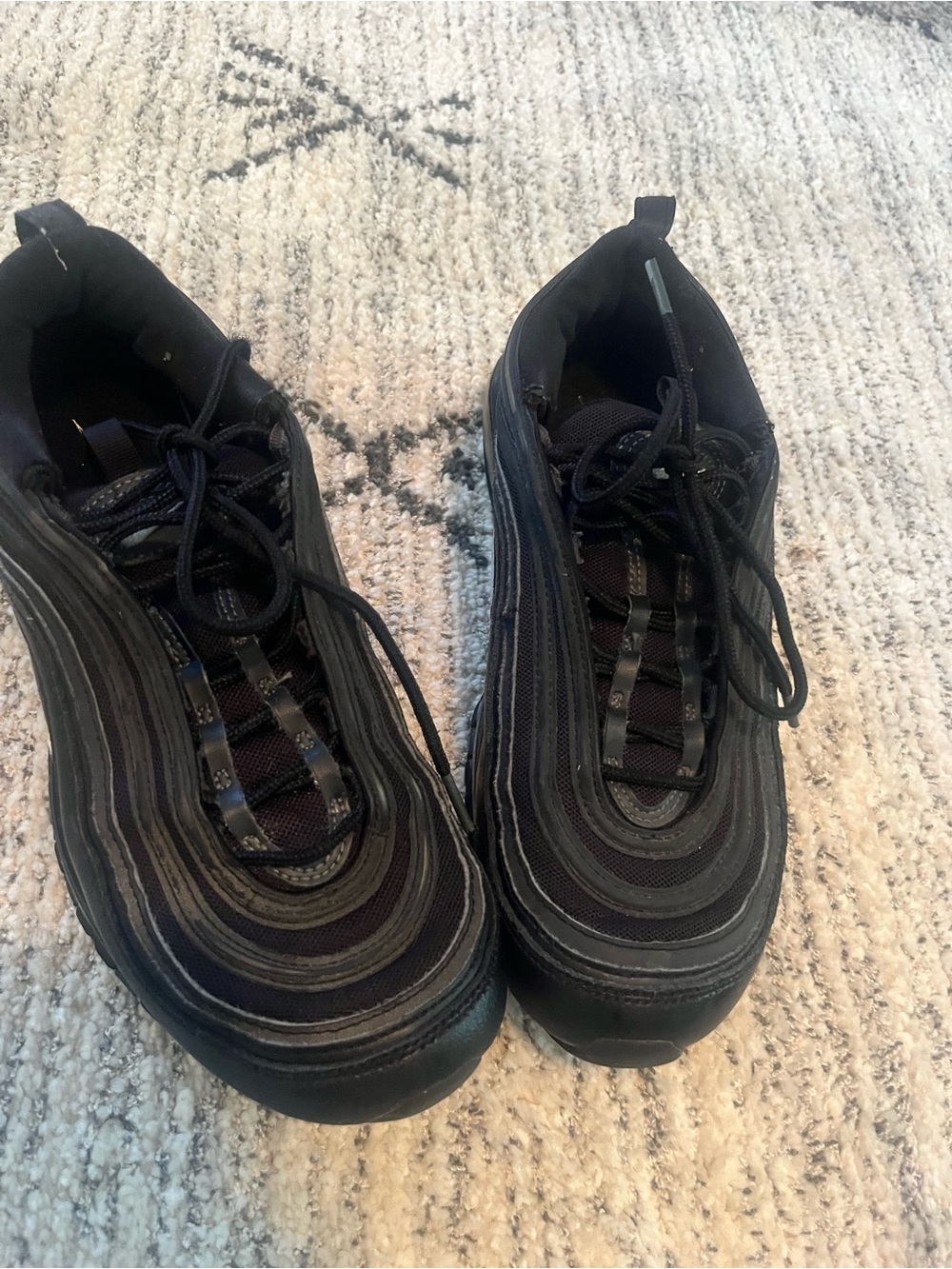 Classic Black Nike Air Max 97 sneakers.